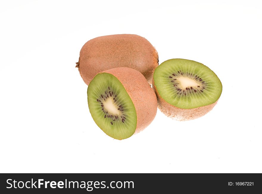 Two kiwi fruit on white background. One of the fruit is cut into two parts. Two kiwi fruit on white background. One of the fruit is cut into two parts.