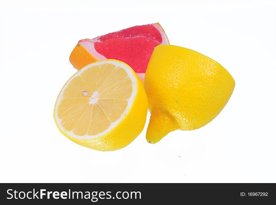 Lemon and grapefruit on white background. Lemon and grapefruit on white background.