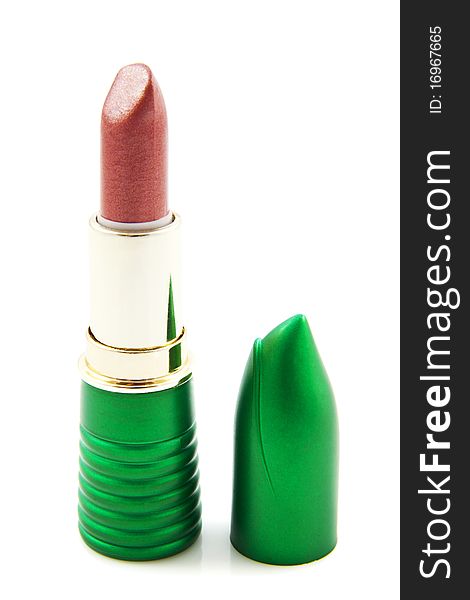 Pink lipstick in green cover isolated over white. Pink lipstick in green cover isolated over white