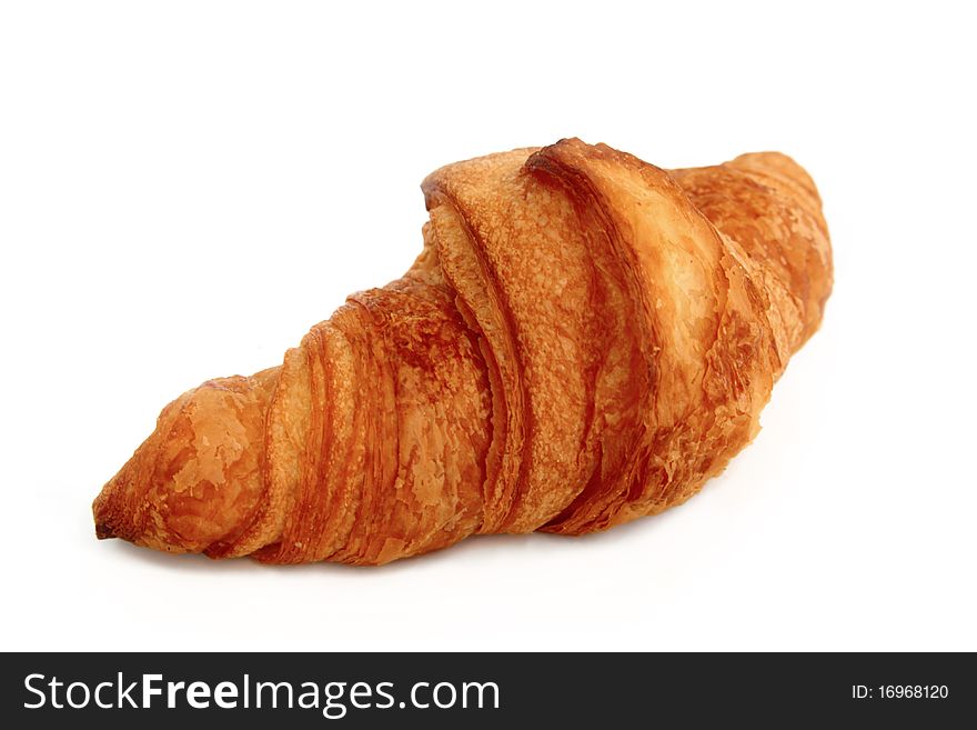 One croissant shot on white background. One croissant shot on white background.