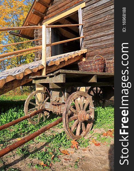 Aging cart near wooden barn