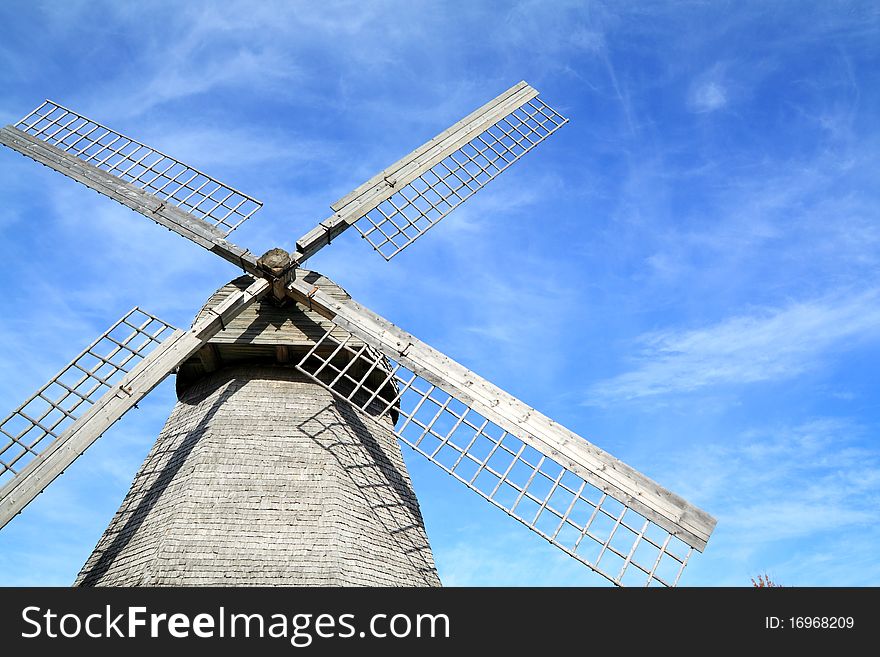 Aging wooden mill on a celestial background