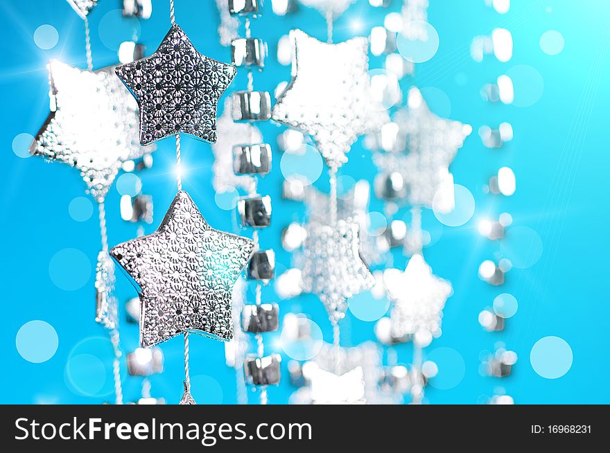 Christmas decoration with silver stars on blue