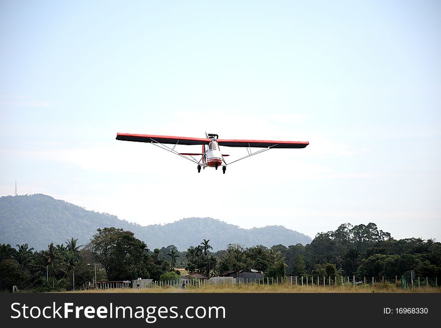 Small single seat plane prepare for landing. Small single seat plane prepare for landing