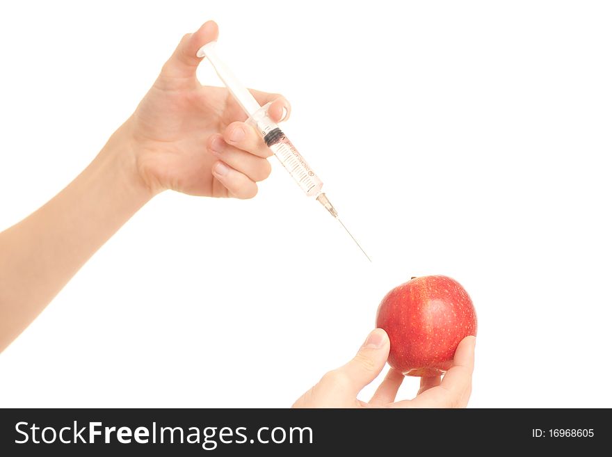 Medical doctor injecting poison to apple on white