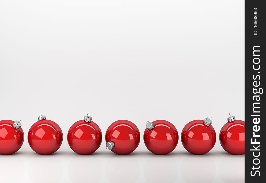 Red Christmas balls abreast on a white background