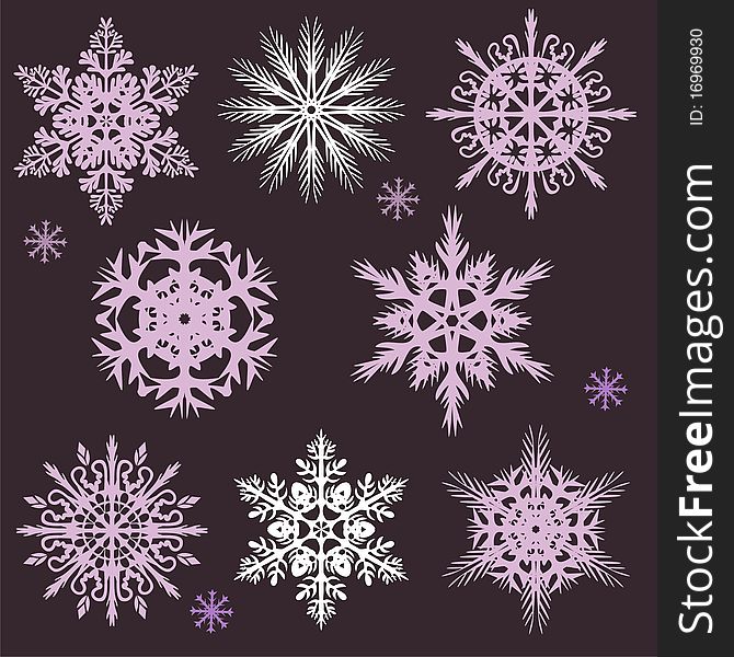 Snowflakes of different shapes on a dark background