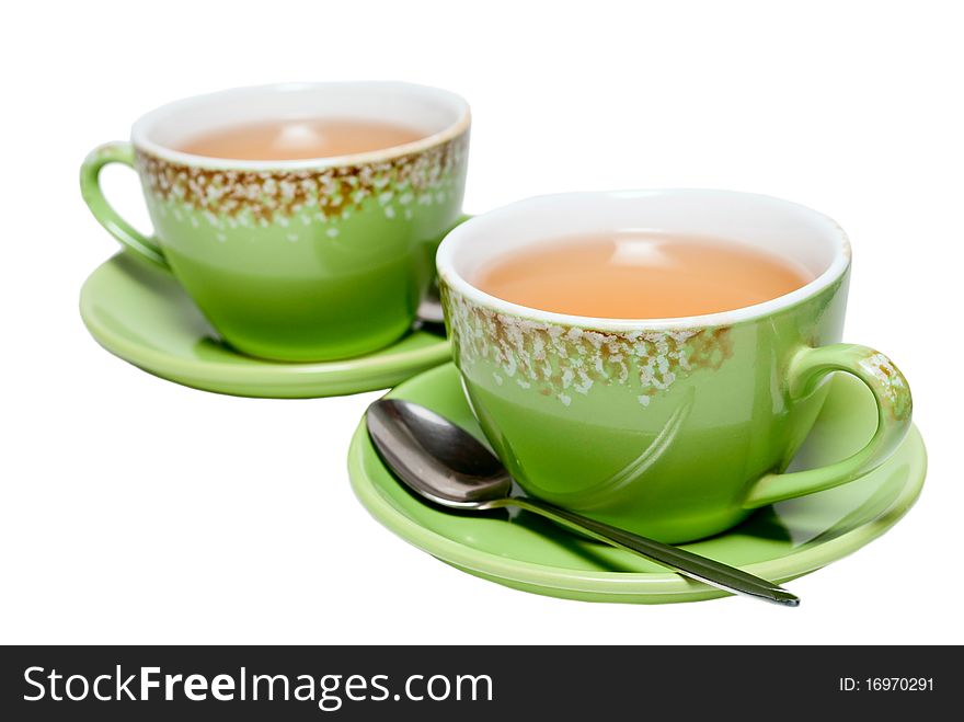 Green tea in a cup on a white background