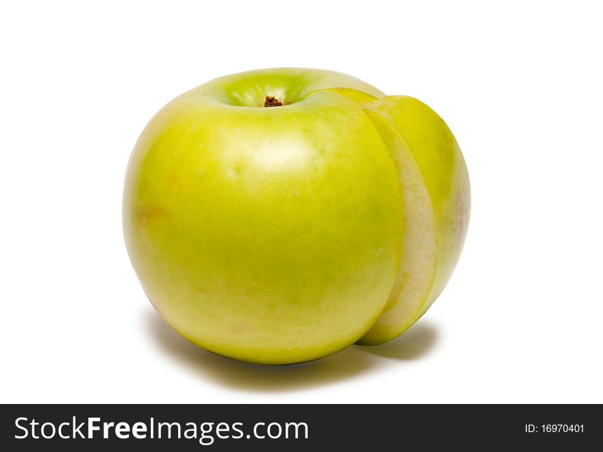 Green apple and a part of it on a white background