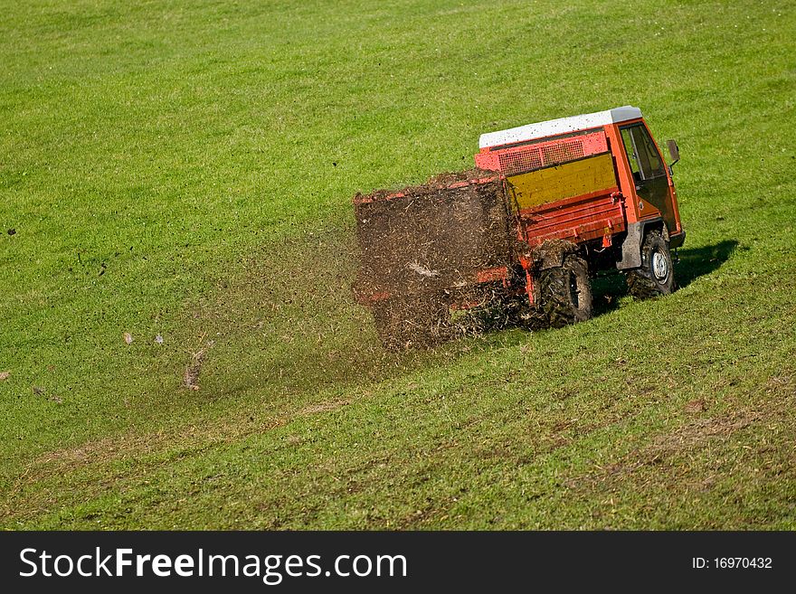 Tractor fertilizing on the field. Tractor fertilizing on the field