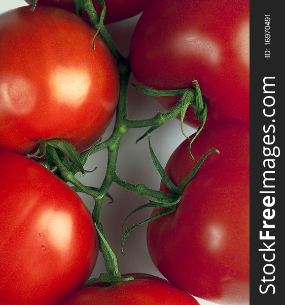 Closeup of red tomatoes on cutting board