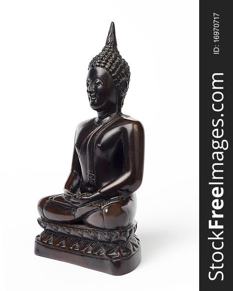 Dark brown wooden carved Buddha figure isolated on white.