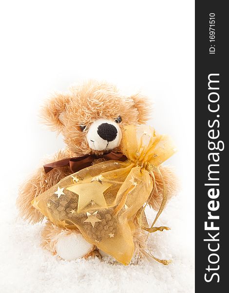 Teddy-bear with christmas gifts on the white background