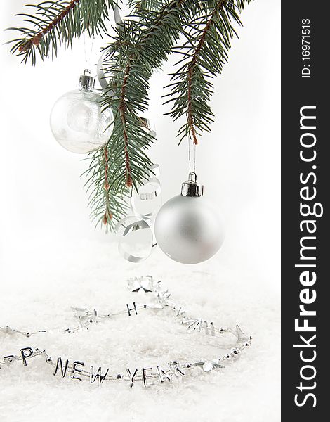 Silver christmas balls with on the christmas tree on a white background