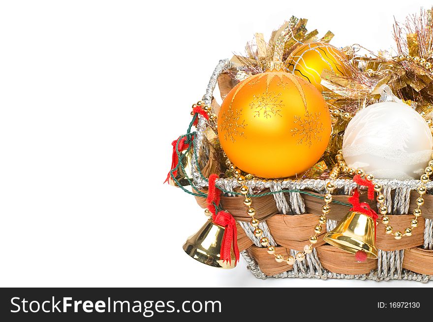 New Year's decoration in a wooden basket with hand bells. New Year's decoration in a wooden basket with hand bells