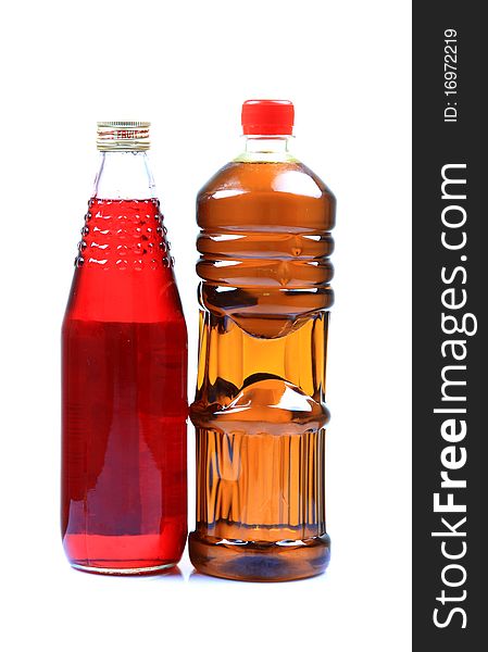 Juice and oil bottles isolated on white background.