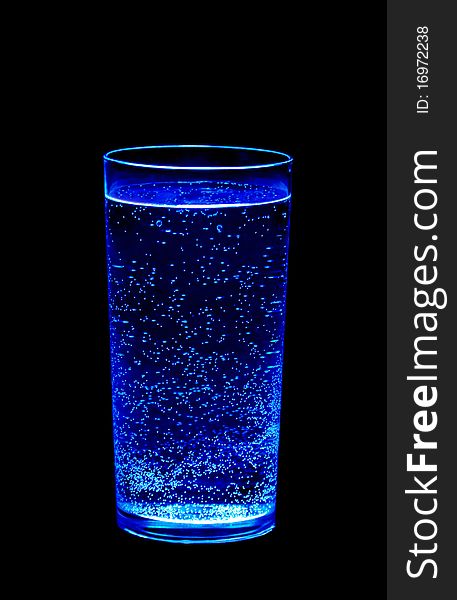 Bubbles in the glass on the black background