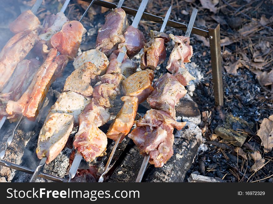 Peaces of meat on skewers and they are fried like stringed on hot coals. Peaces of meat on skewers and they are fried like stringed on hot coals