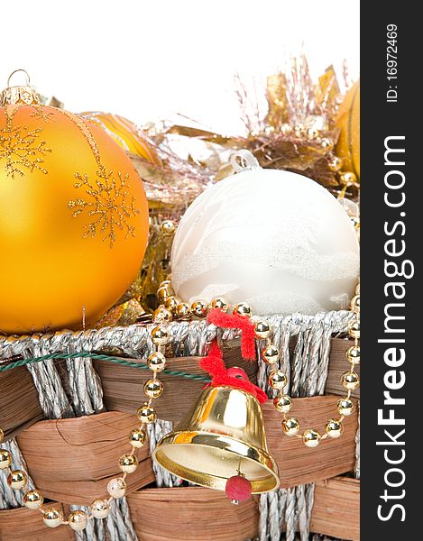 New Year's decoration in a wooden basket with hand bells. New Year's decoration in a wooden basket with hand bells