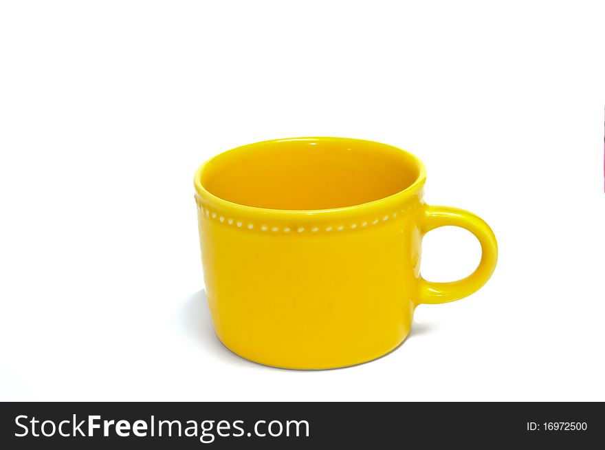 Yellow ceramic cup isolated on white background. Yellow ceramic cup isolated on white background.