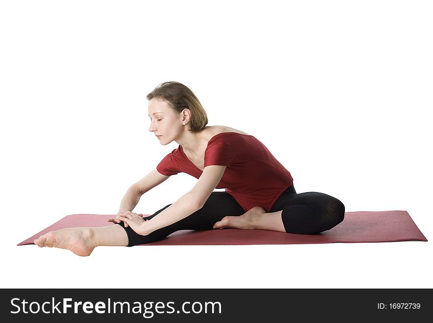 Woman exercising on a mat over white background. Woman exercising on a mat over white background