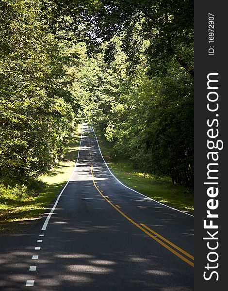 Beautiful scenic country road curves through Shenandoah National Park. Beautiful scenic country road curves through Shenandoah National Park.