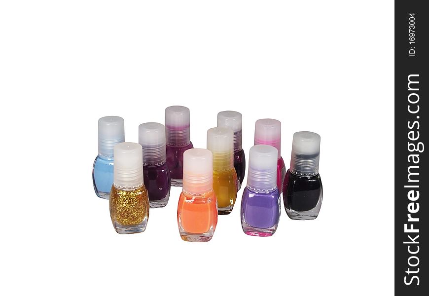 Ten bottles of a varnish of different colours on a white background. Ten bottles of a varnish of different colours on a white background
