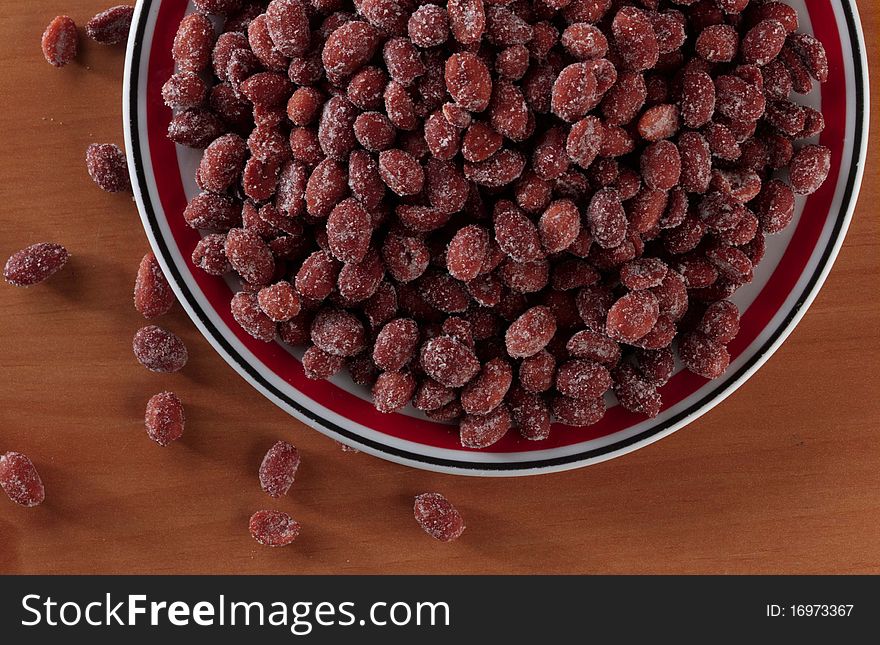 Large bowl of honey roasted peanuts served on a table