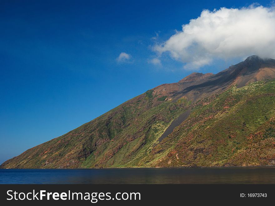 a cloud on the top of the mountain