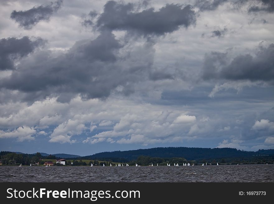 Clouds over the lake Lipno, with sails