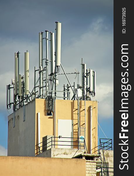 Mobile Telephone Antennas installed on the top of a building