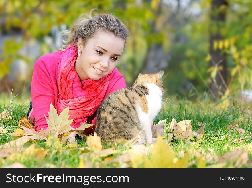 Attractive girl and cat on natural background. Attractive girl and cat on natural background