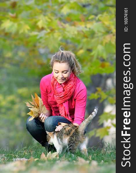 Attractive young girl and cat on natural background. Attractive young girl and cat on natural background