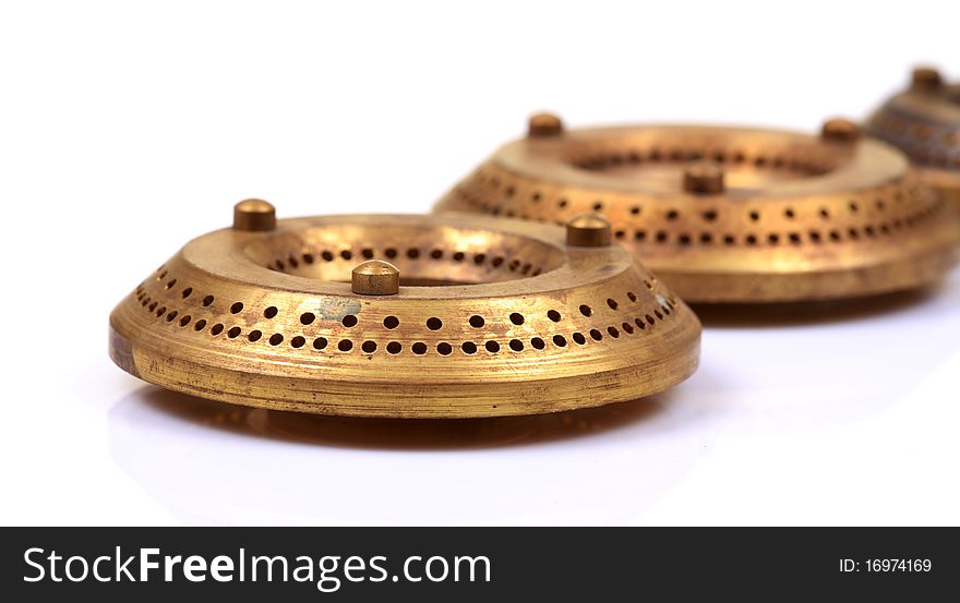Brass gas burners isolated on white background.
