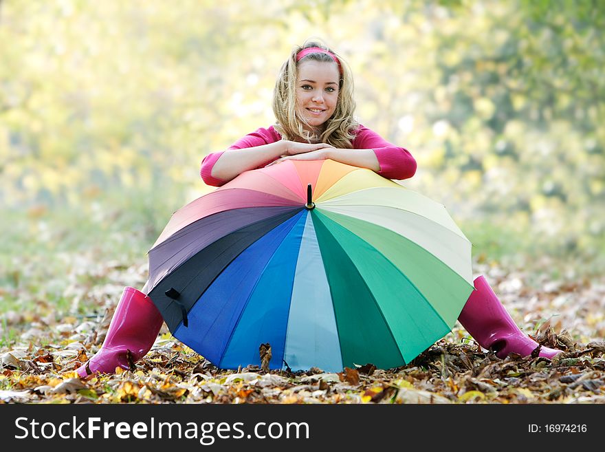 Young Happy Girl With Colorful Umbrella On Nature