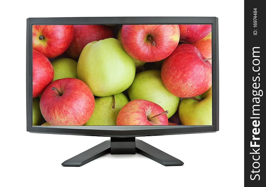 Monitor isolated on white background with red and green apples on the screen. Monitor isolated on white background with red and green apples on the screen