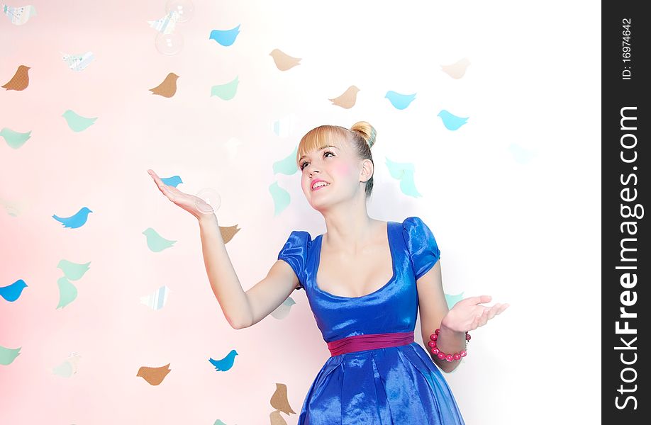 Studio portrait of young happy girl on fantasy background