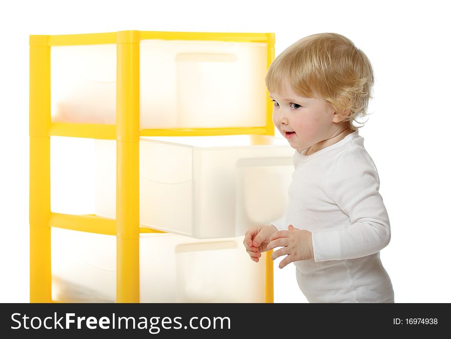 1 year old baby having just opened a what-not's box isolated on white. 1 year old baby having just opened a what-not's box isolated on white