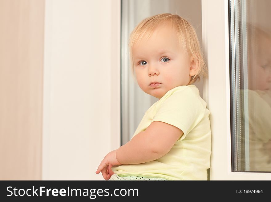 Girl Sitting On The Window Sill