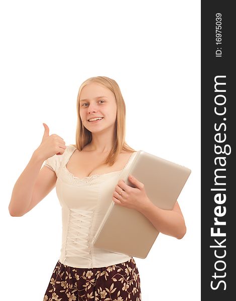 Portrait of Young adorable businesswoman giving the thumbs up sign and holding silver laptop on white