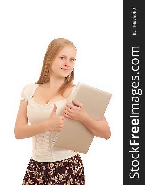 Portrait of Young adorable businesswoman giving the thumbs up sign and holding silver laptop on white. Portrait of Young adorable businesswoman giving the thumbs up sign and holding silver laptop on white