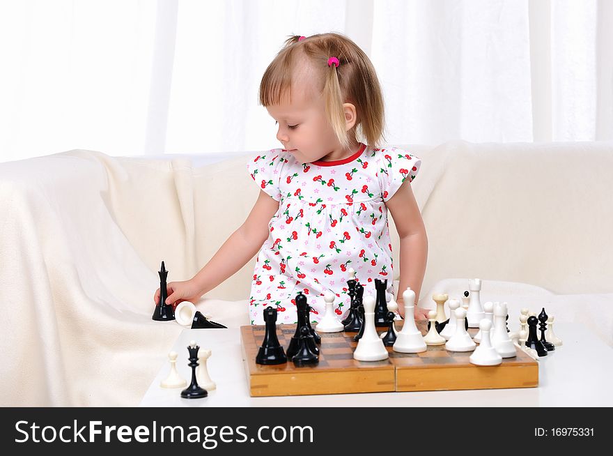 Little Girl Playing Chess