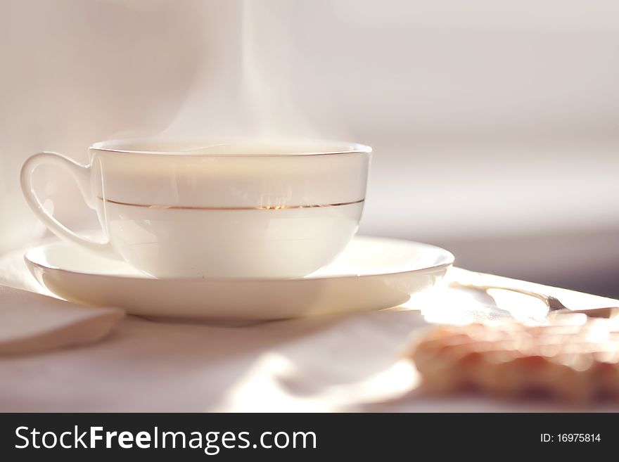 Hot coffee with wafers, close-up