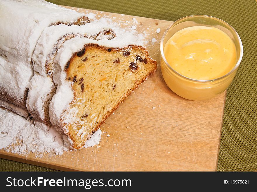 Detail on christmas stollen with egg yellow cream