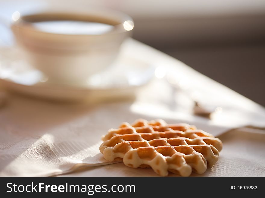 Hot coffee with wafers, close-up