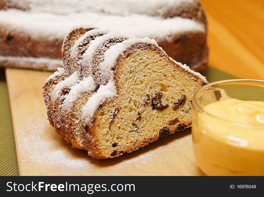 Detail on christmas stollen with egg yellow cream