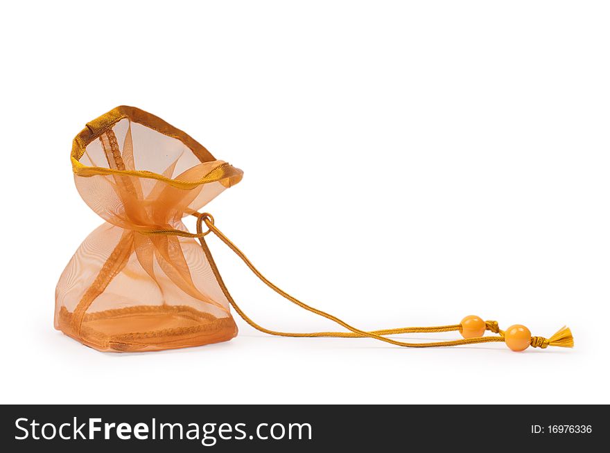 Horizontal closeup shot of golden gift sac isolated on white background