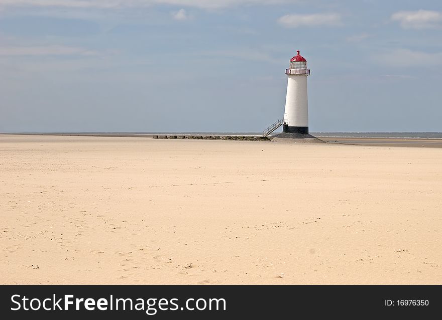 North Wales lighthouse on deserted beach