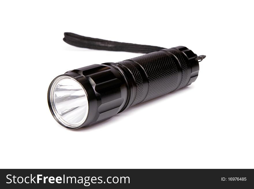 Black flashlight isolated on white background