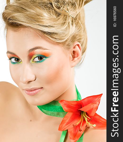 Beauty young woman with red flower on her neck. Beauty young woman with red flower on her neck